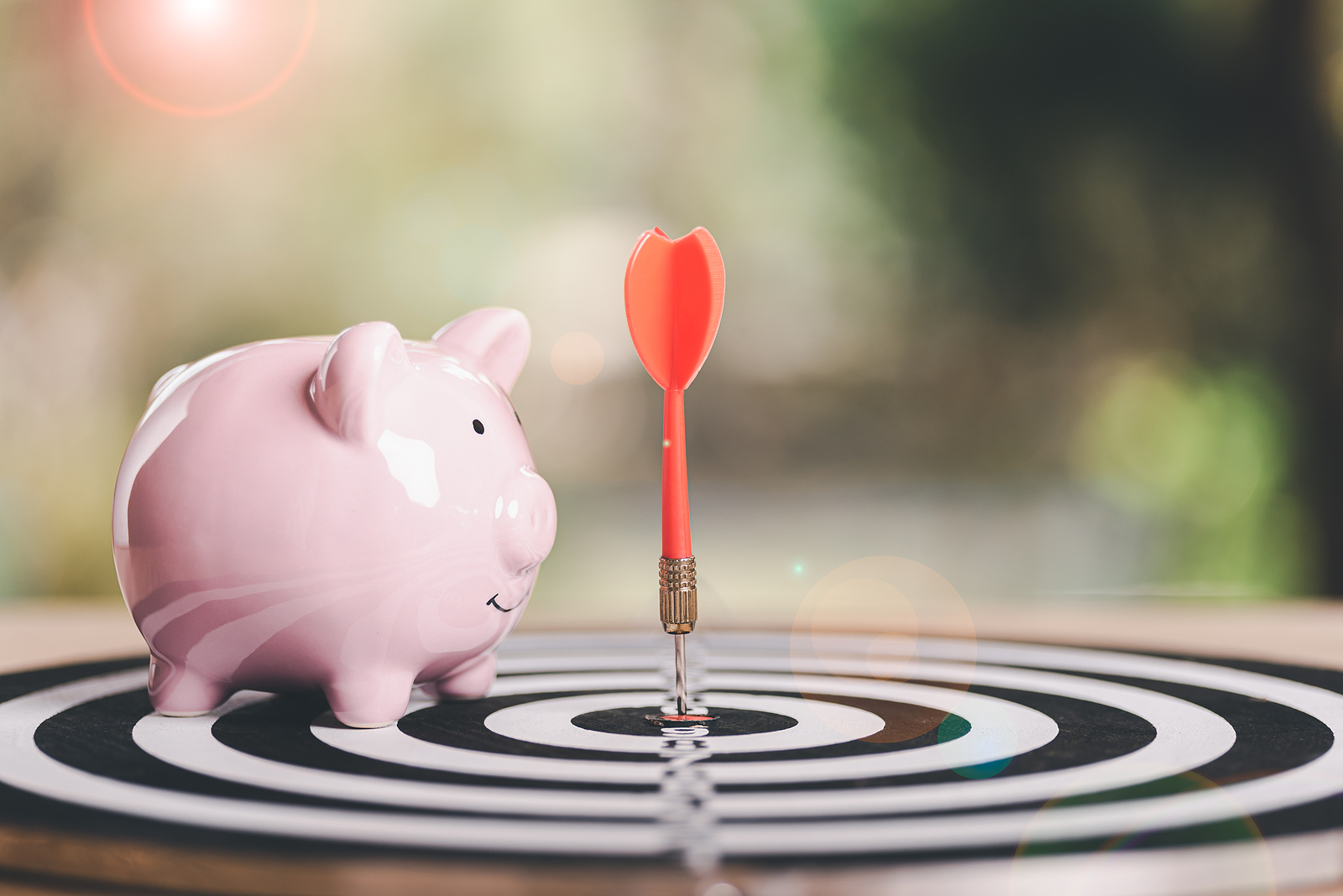 stethoscope around a piggybank